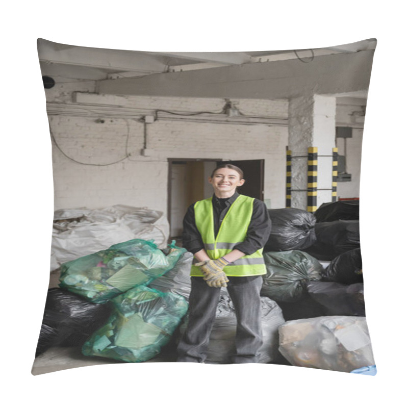 Personality  Smiling Female Worker In Protective Gloves And Vest Looking At Camera While Standing Near Plastic Bags With Trash In Garbage Sorting Center, Recycling Concept Pillow Covers