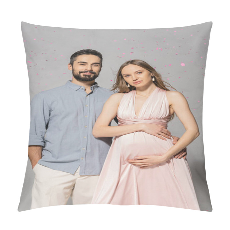 Personality  Portrait Of Smiling Man Hugging Elegant And Pregnant Wife In Pink Dress While Standing Under Confetti During Baby Shower Party On Grey Background, Expecting Parents Concept  Pillow Covers