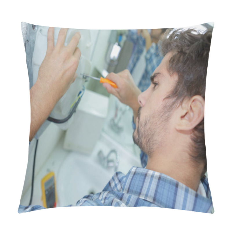 Personality  Tradesman Fixing Electrical Issue With Hand Dryer Pillow Covers