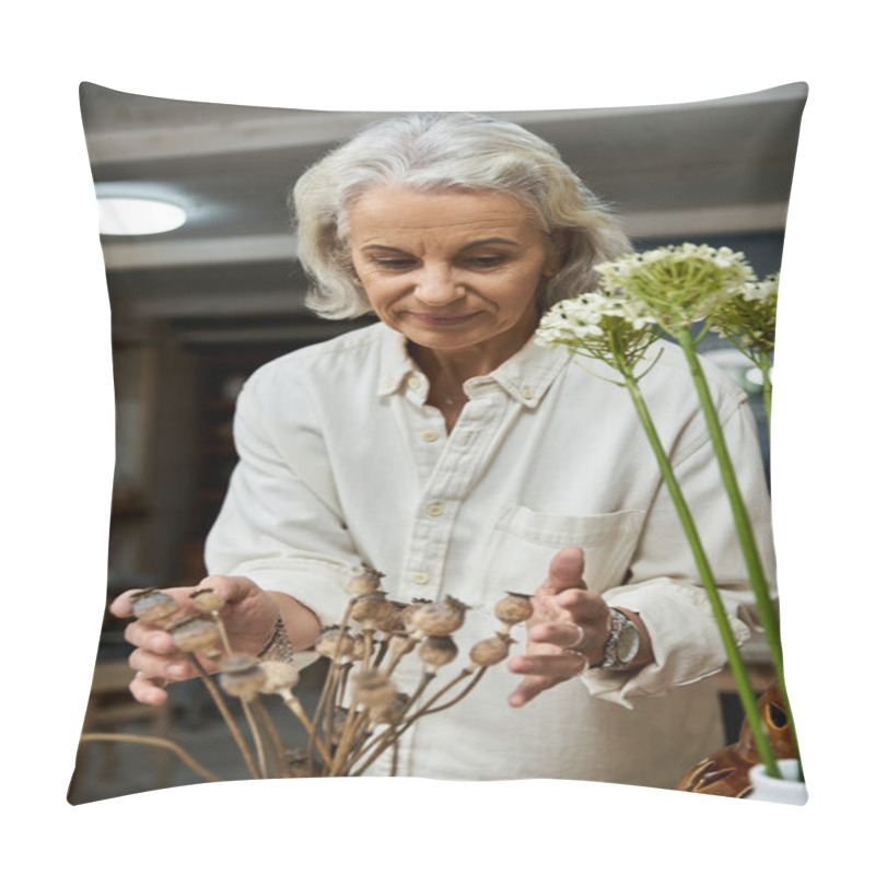 Personality  A Mature Woman Artfully Arranging Dried Floral Stems In A Serene, Warmly Lit Space. Pillow Covers