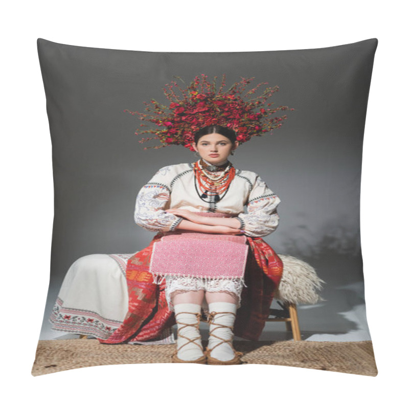 Personality  Full Length Of Young Ukrainian Woman In Traditional Clothing And Floral Red Wreath Sitting On Bench On Grey Pillow Covers