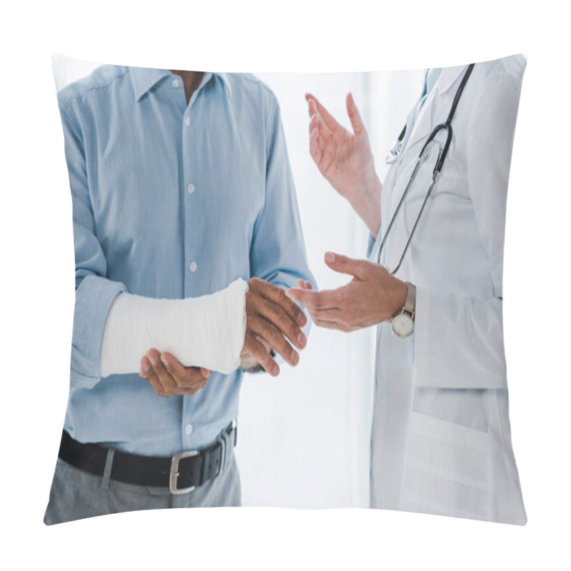 Personality  Cropped View Of Doctor Gesturing Near Man With Broken Arm In Clinic  Pillow Covers