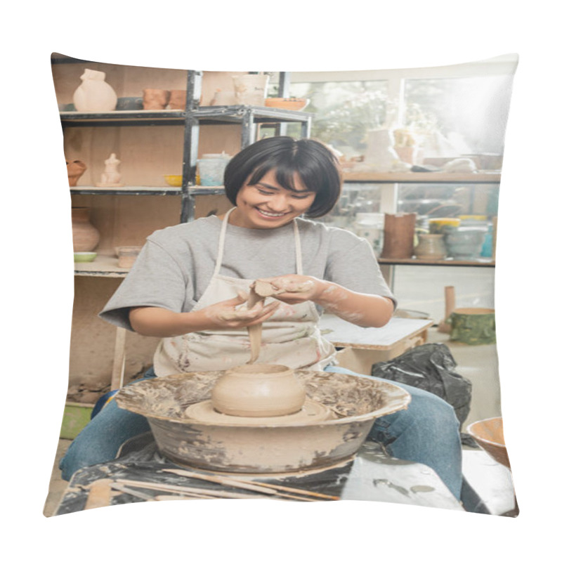 Personality  Positive Young Asian Female Potter In Apron Holding Clay Near Vase On Spinning Pottery Wheel And Wooden Tools And Bowl In Blurred Ceramic Studio, Artisanal Pottery Production And Process Pillow Covers