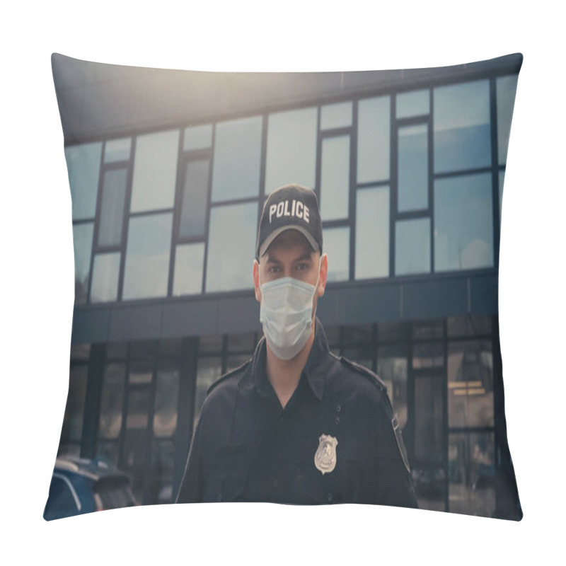 Personality  Police Officer In Medical Mask And Uniform With Badge Looking At Camera Near Building  Pillow Covers