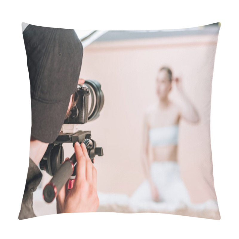 Personality  Rear View Of Videographer With Camera Working With Woman In Photo Studio Pillow Covers