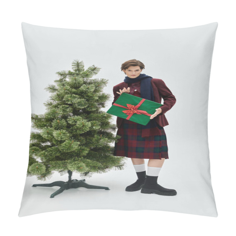 Personality  A Stylish Woman In Winter Attire Stands Beside A Christmas Tree, Holding A Beautifully Wrapped Gift. Pillow Covers