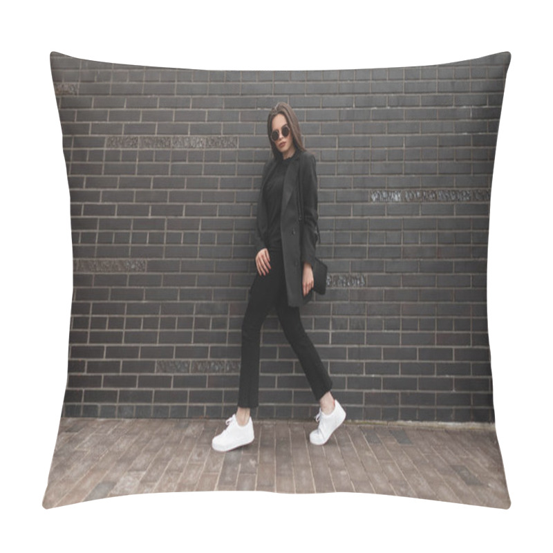 Personality  Pretty Young Stylish Woman In Fashionable Black Woolen Clothes With A Business Blazer And White Sneakers With A Handbag Walks Near A Black Brick Wall On The Street Pillow Covers