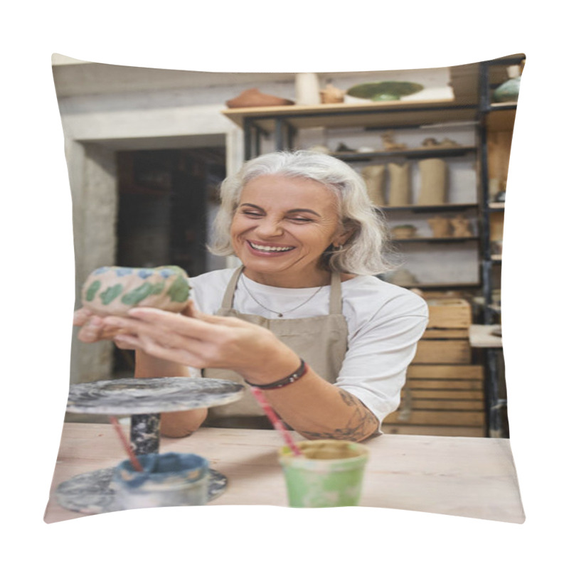 Personality  A Mature Woman Smiles Brightly While Crafting A Unique Pottery Piece In Her Artistic Studio Setting. Pillow Covers