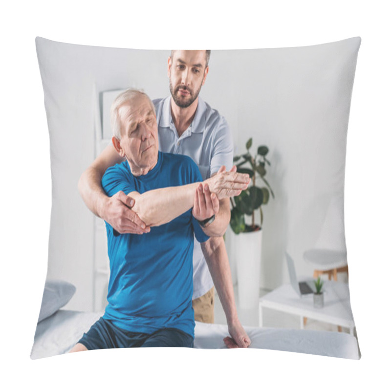 Personality  Portrait Of Physiotherapist Doing Massage To Senior Man On Massage Table Pillow Covers