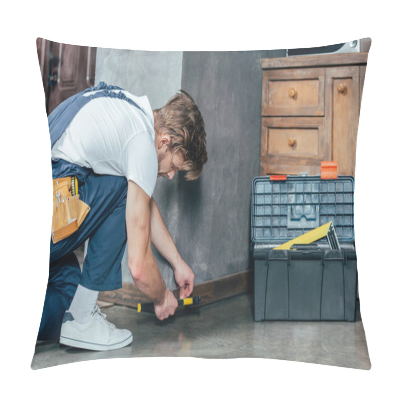 Personality  Professional Young Foreman Hammering Nail Into Baseboard Pillow Covers