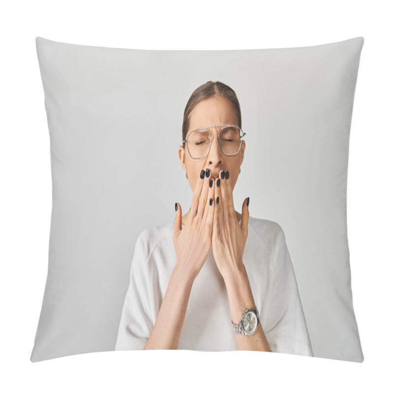 Personality  A Young Woman In A White T-shirt And Glasses Covering Her Mouth With Her Hands On A Grey Background. Pillow Covers