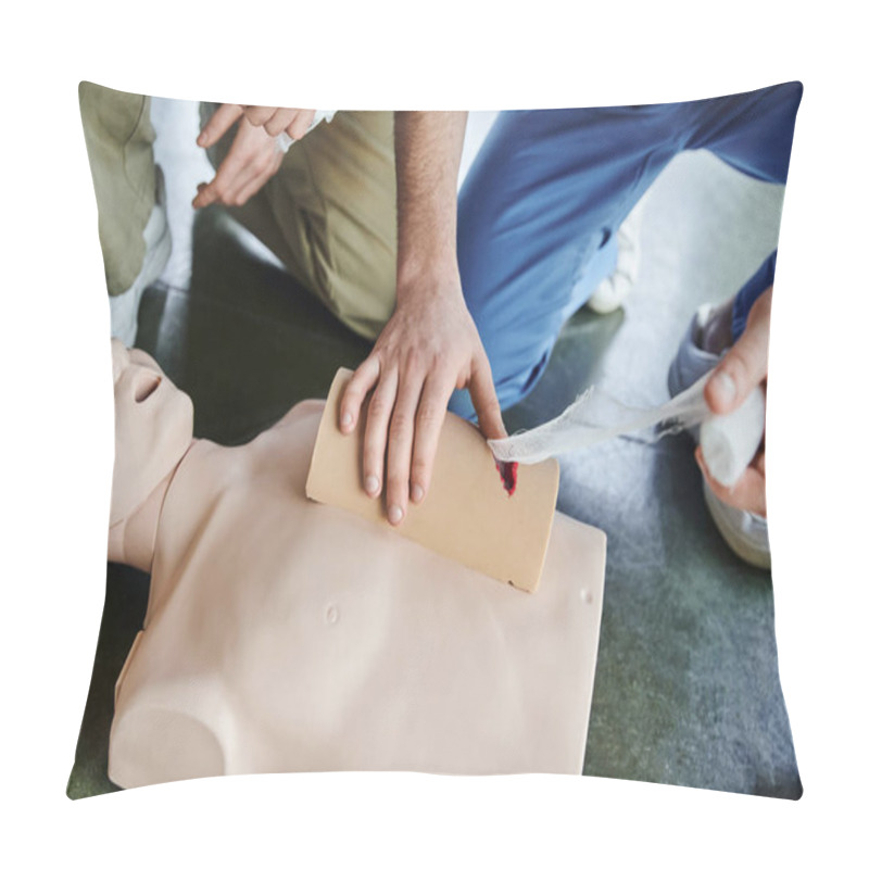 Personality  High Angle View Of Medical Instructor Tamponing Wound On Simulator With Bandage Near CPR Manikin And Young Man During First Aid Training Seminar, Emergency Response Concept, Cropped View Pillow Covers