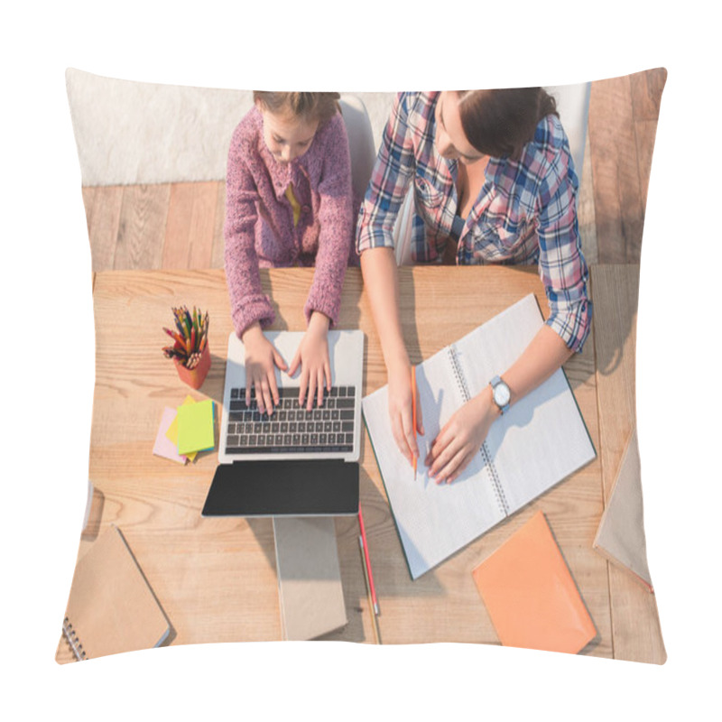 Personality  Top View Of Mother Sitting Near Daughter Typing On Laptop At Desk With Stationery At Home Pillow Covers