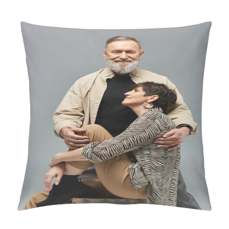 Personality  A Middle-aged Man Sits Triumphantly On Top Of A Woman In Stylish Attire In A Studio Setting. Pillow Covers