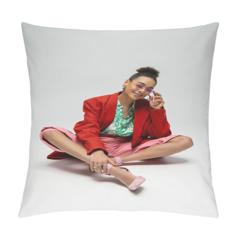 Personality  Cheerful African American Woman In Bold Style Attire And Sunglasses Sitting On Grey Backdrop Pillow Covers