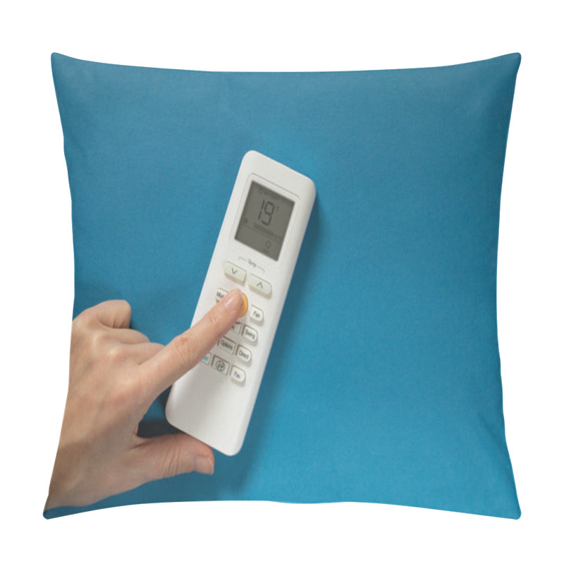 Personality  Female Hand Switches Button On White Remote Control Of Air Conditioner On Isolated Background Pillow Covers