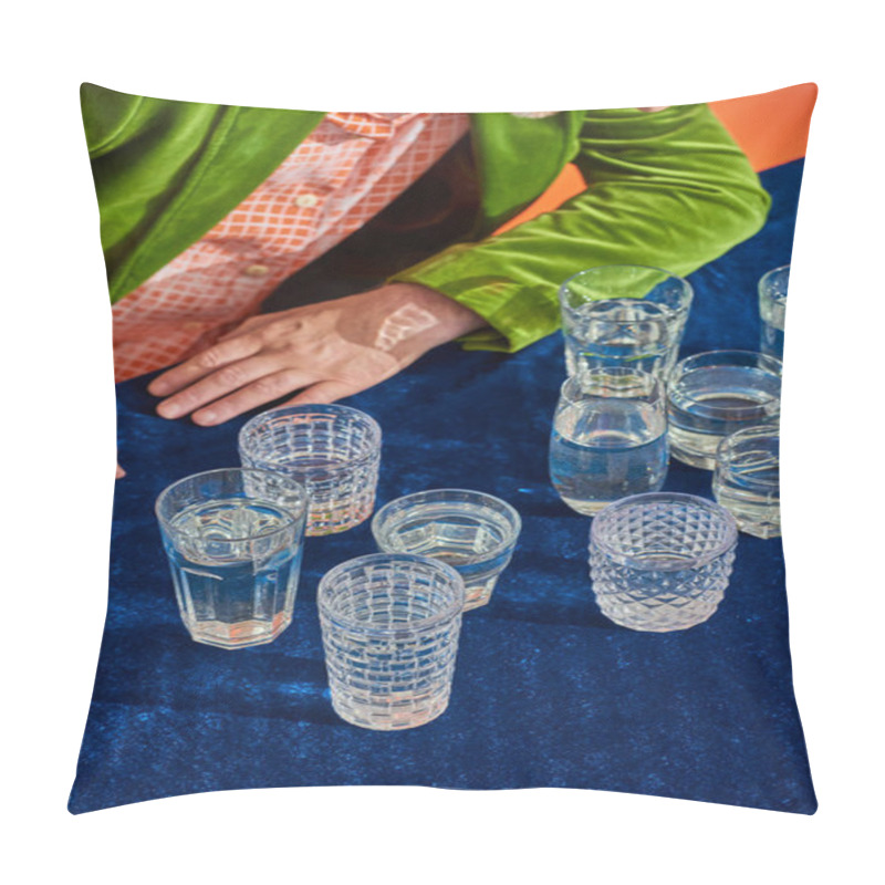 Personality  Cropped View Of Senior Man In Trendy And Green Velvet Blazer Sitting Near Crystal Glasses With Clear Water On Table With Blue Velour Cloth On Orange Background, Symbolism, Life Fullness Concept Pillow Covers