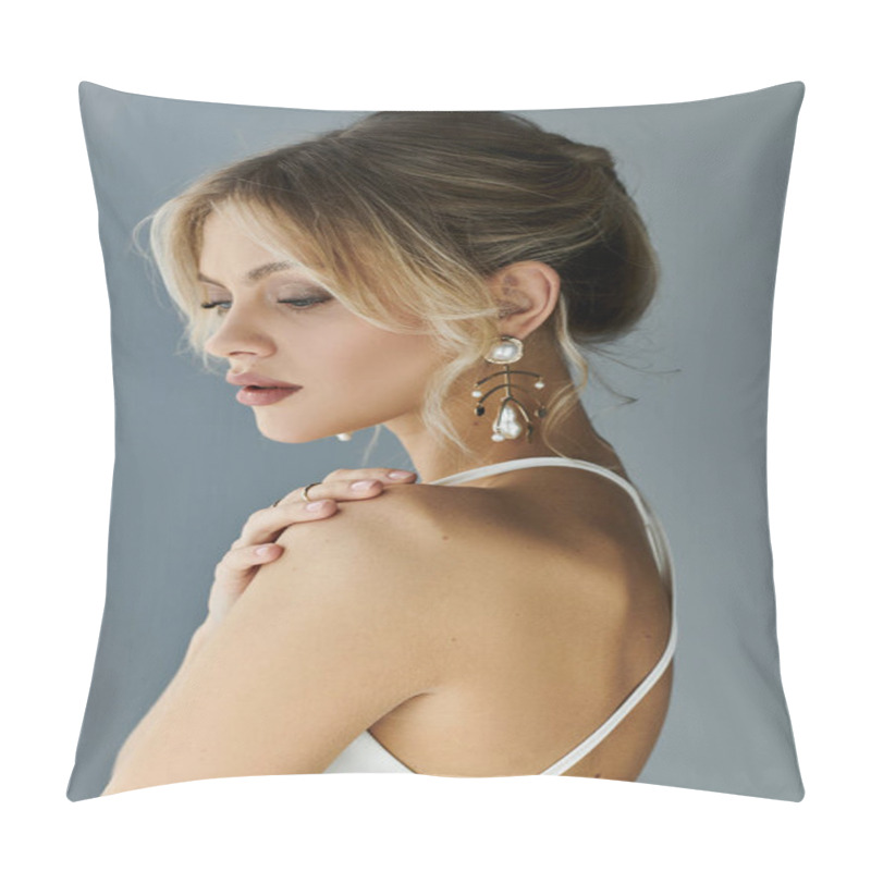 Personality  A Stunning Young Woman With Blonde Hair Exudes Elegance In A White Dress And Earrings Against A Grey Backdrop. Pillow Covers