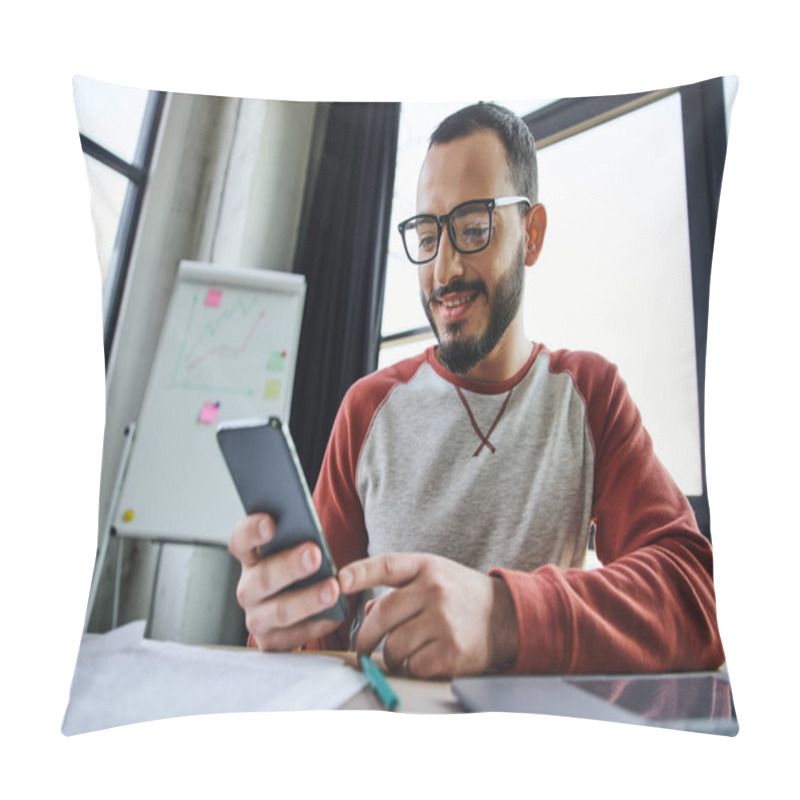 Personality  Joyful And Bearded Businessman In Stylish Eyeglasses Networking On Smartphone While Sitting Next To Laptop, Documents And Flip Chart On Blurred Background In Modern Office Pillow Covers