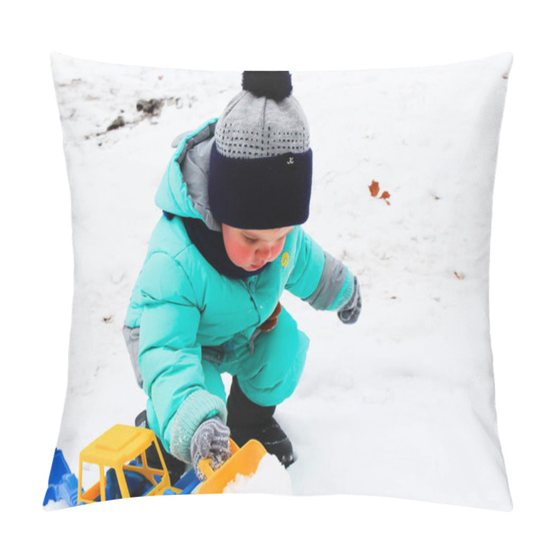 Personality  A Boy In The Yard Playing With An Excavator. Snow In The Yard. The Boy Is Dressed In Winter Clothes: Aqua Down-padded Coat, Knitted Hat, Mittens. Excavator Yellow-blue. Pillow Covers