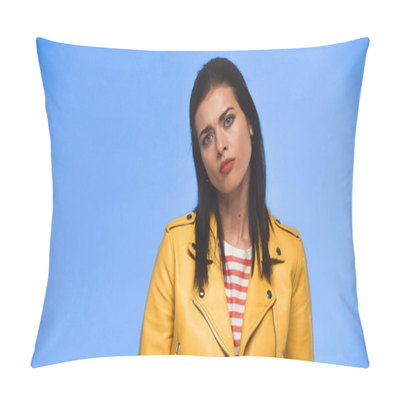 Personality  Skeptical Woman In Yellow Jacket Looking At Camera Isolated On Blue Pillow Covers