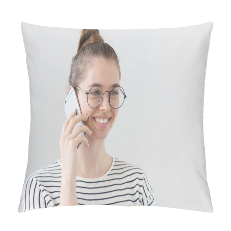 Personality  Side Portrait Of Young European Female Isolated On Gray Background Wearing Hipster Eyeglasses, Listening To Interlocutor On Smartphone, Showing Satisfied Happy Smile From News She Is Hearing. Pillow Covers