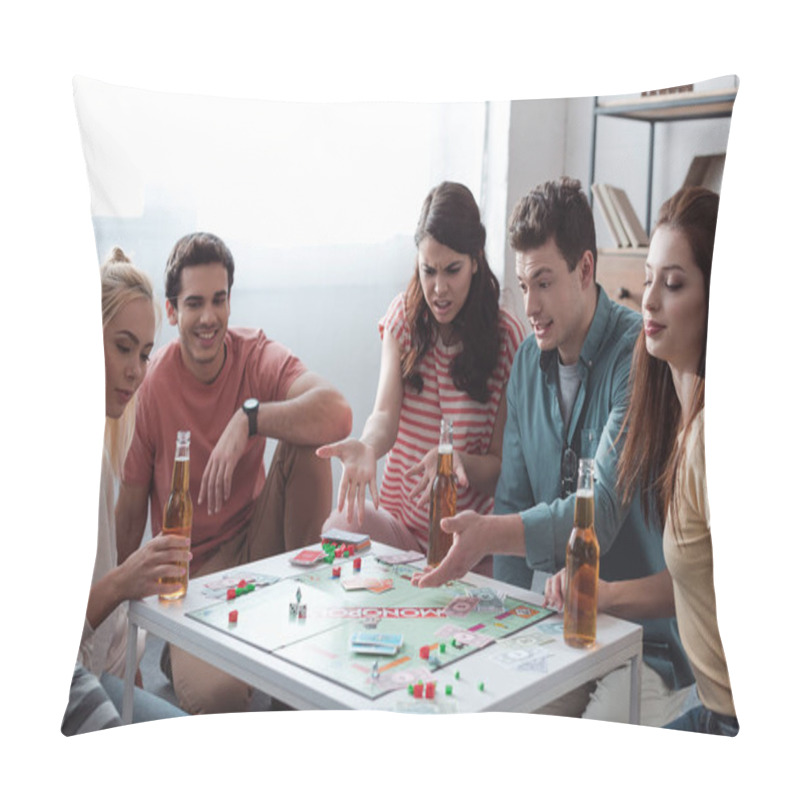 Personality  KYIV, UKRAINE - JANUARY 27, 2020: Angry Girl And Man Pointing With Hands While Playing Monopoly Game With Smiling Friends Pillow Covers