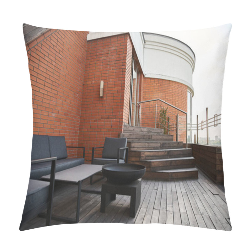 Personality  A Serene Wooden Deck Adorned With Stylish Black Furniture Sits Against A Backdrop Of A Charming Brick Building Pillow Covers