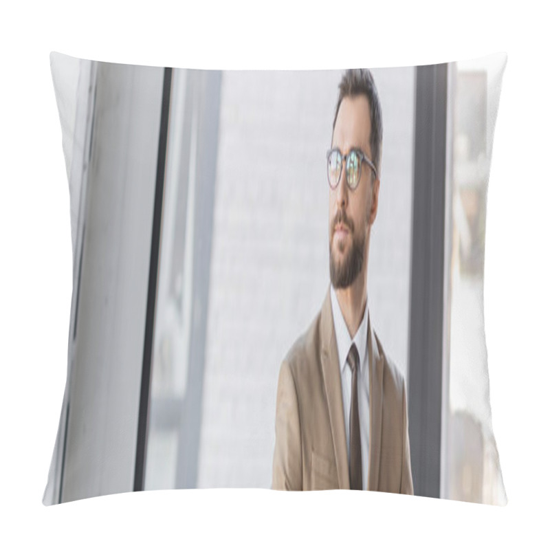 Personality  Accomplished And Confident Bearded Businessman In Beige Blazer, Tie And Stylish Eyeglasses Looking Away While Standing In Contemporary Office On Blurred Background, Banner Pillow Covers