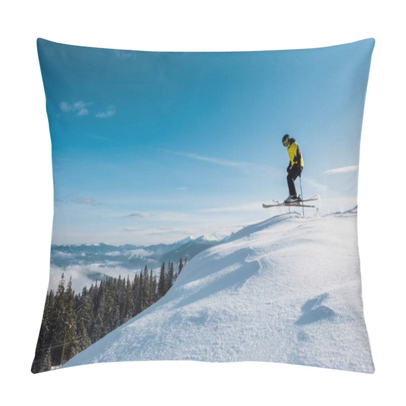 Personality  Side View Of Skier Holding Ski Sticks And Jumping Against Blue Sky In Mountains  Pillow Covers