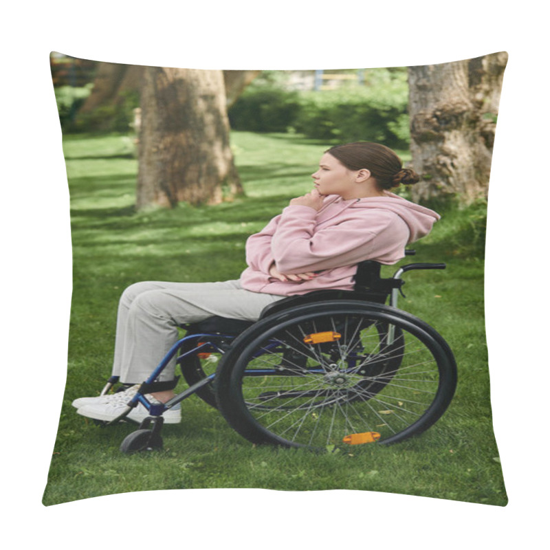 Personality  A Young Woman In A Pink Hoodie Sits In A Wheelchair In A Grassy Park. Pillow Covers