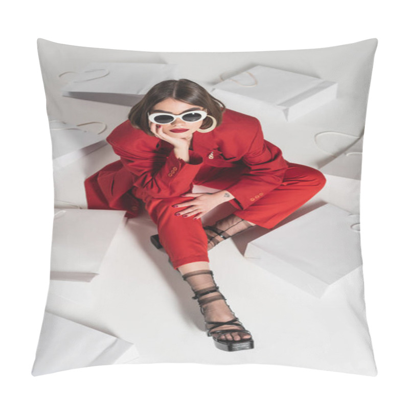 Personality  Consumerism, Young Woman With Brunette Short Hair, Nose Piercing And Tattoo Posing In Sunglasses And Red Suit While Sitting Around Shopping Bags On Grey Background, High Angle View  Pillow Covers