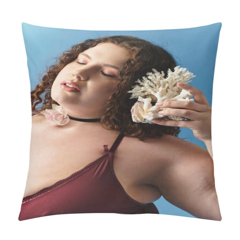 Personality  Young Woman Embodies Elegance And Style Holding Coral Against A Vibrant Blue Background. Pillow Covers