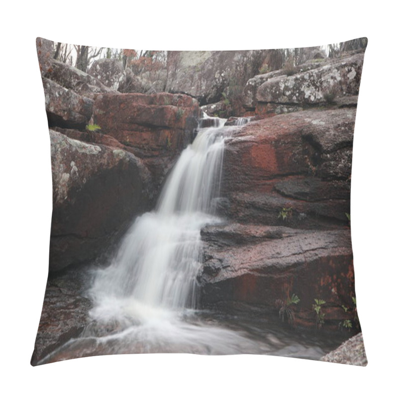 Personality  A Serene Waterfall Cascades Over Weathered Red Rocks, Surrounded By Lush Greenery, Creating A Tranquil And Inviting Scene.    Pillow Covers