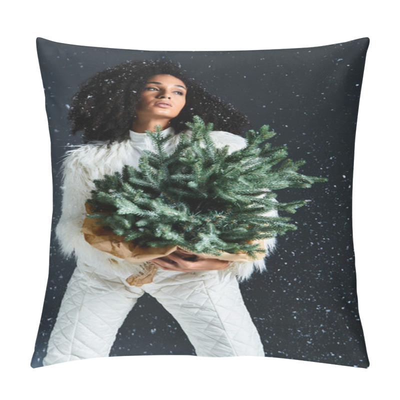 Personality  A Stunning African American Woman In Winter Fashion Showcases Style While Holding A Holiday Tree Surrounded By Snow. Pillow Covers