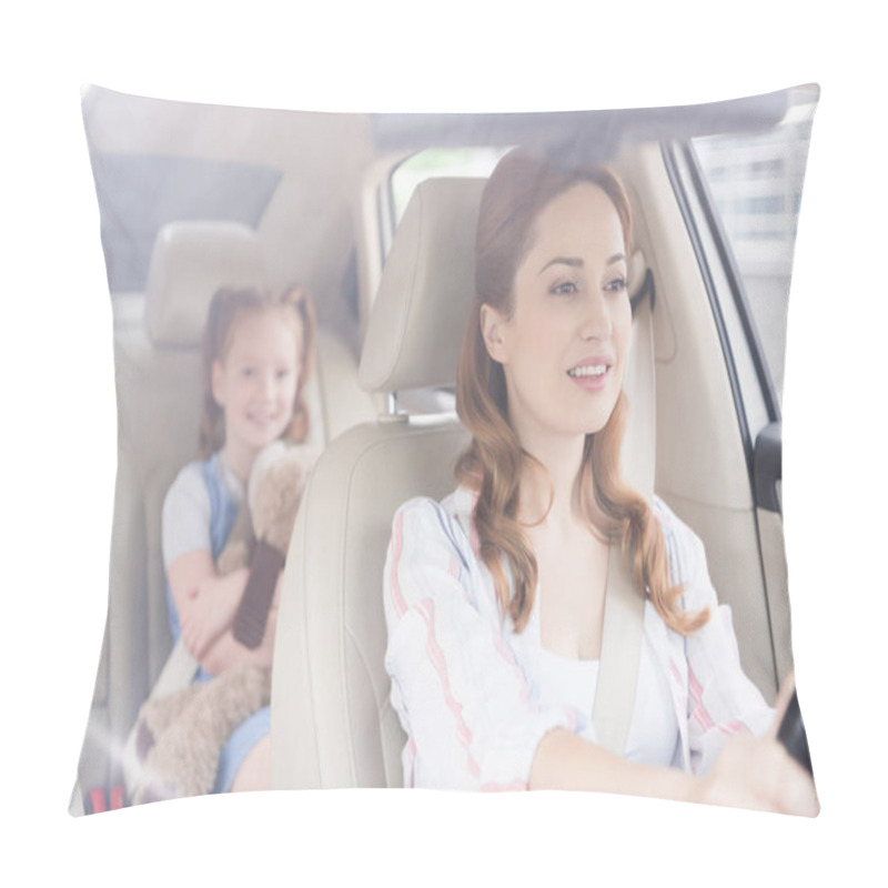 Personality  Selective Focus Of Smiling Mother Driving Car With Daughter On Passengers Seat Behind Pillow Covers