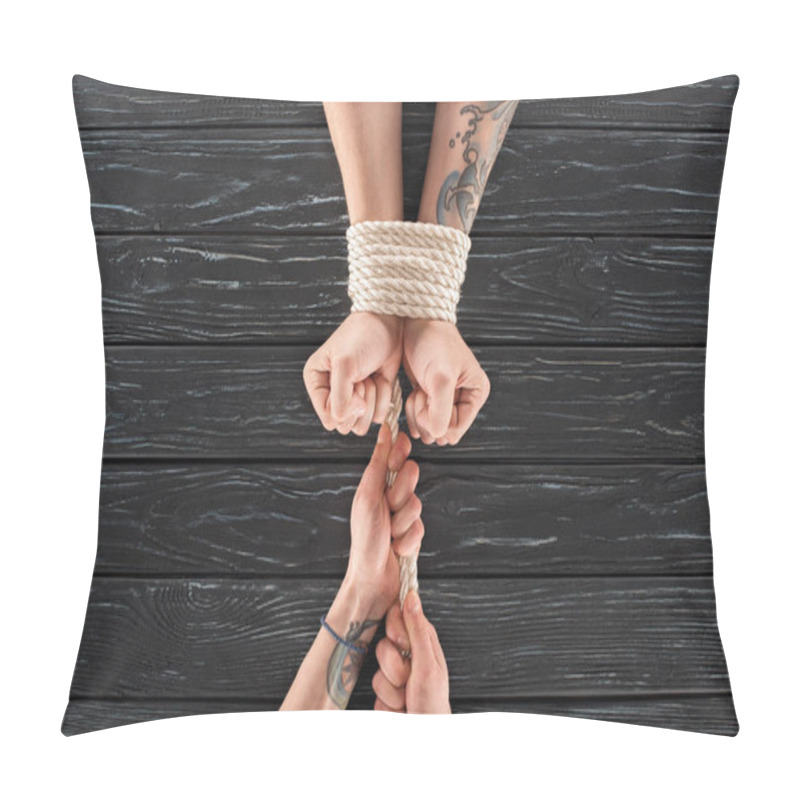 Personality  Partial View Of Woman Tying Rope Around Males Hands On Dark Wooden Surface Pillow Covers