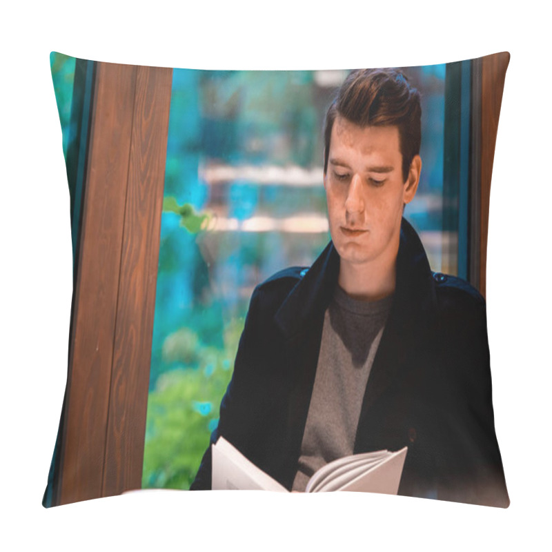 Personality  Young Pensive Handsome Man Reading Book And Drinking Tea Or Coffee On Rainy Day In Cozy Modern Cafe Pillow Covers