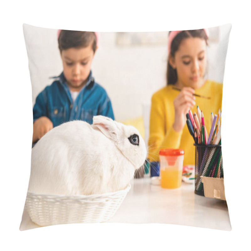 Personality  Selective Focus Of Adorable Kids Painting Easter Eggs While Sitting At Desk Near White Rabbit In Wicker Pillow Covers