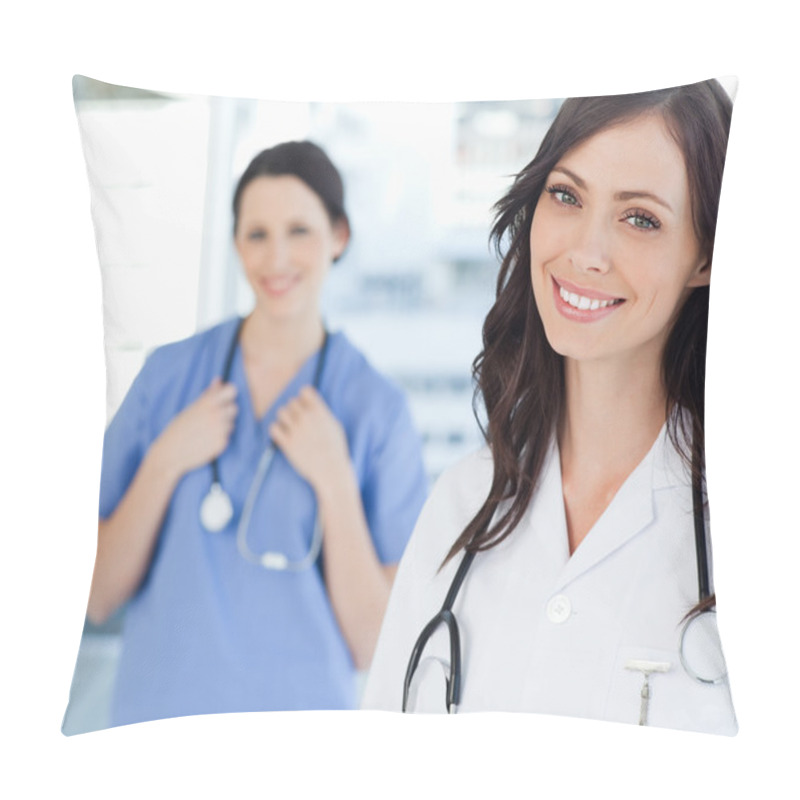 Personality  Smiling Nurse Standing Upright While Leaning Her Head To The Sid Pillow Covers