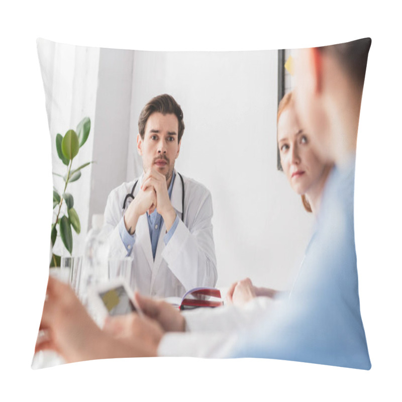 Personality  Doctor Looking At Colleague While Working With Notebook And Digital Tablet On Blurred Foreground  Pillow Covers