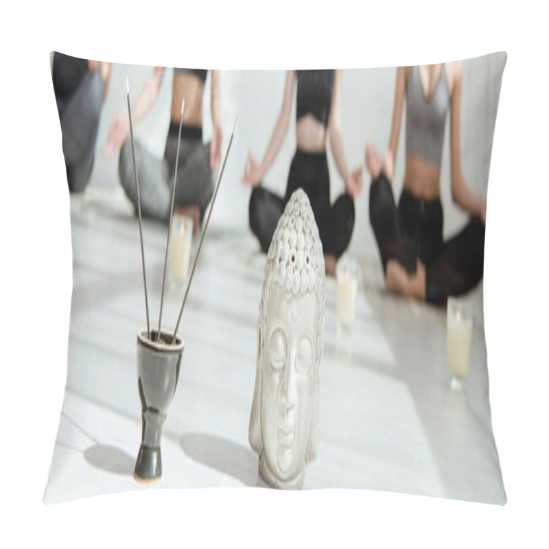 Personality  Selective Focus Of Decorative Buddha Head, Aromatic Sticks And Candles, And Young People Practicing Yoga In Half Lotus Pose, Panoramic Shot Pillow Covers