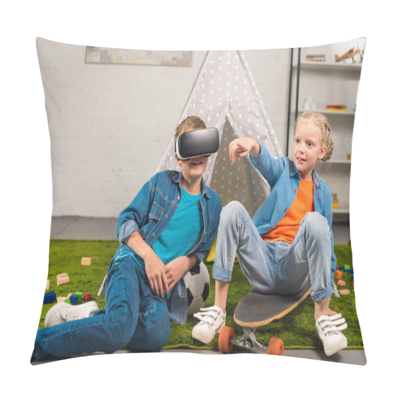 Personality  Boy Using Virtual Reality Headset  And His Sister Pointing By Finger While Sitting On Skateboard Near Wigwam At Home Pillow Covers