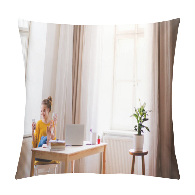 Personality  A Young Female Student Sitting At The Table, Using Smartpone When Studying. Pillow Covers