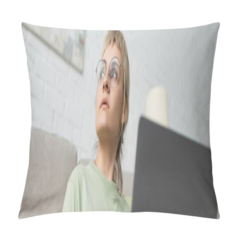 Personality  Low Angle View Of Pensive Woman With Blonde And Short Hair, Bangs And Eyeglasses Using Laptop While Sitting Near Comfortable Couch In Modern Living Room With Paiting On Wall, Banner  Pillow Covers