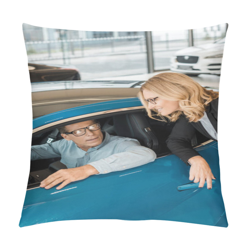 Personality  Adult Man Sitting In Sport Car At Showroom While Smiling Female Car Dealer Standing Outside Pillow Covers