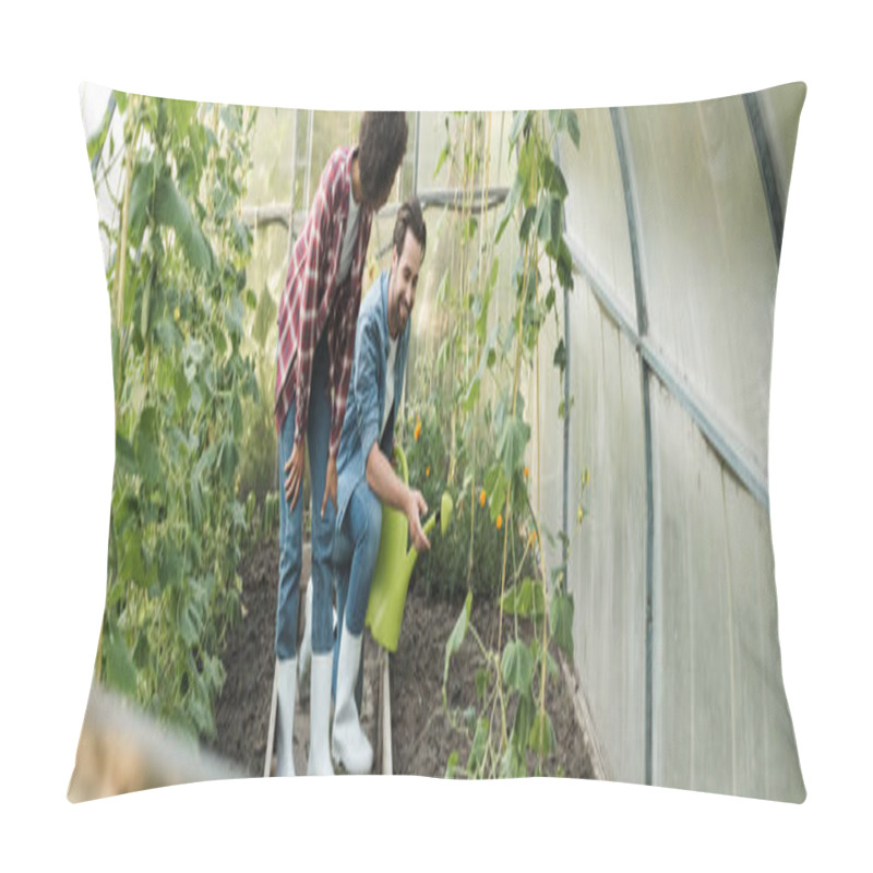 Personality  Happy Farmer With Watering Can Pointing At Garden Bed In Hothouse Near African American Colleague, Banner Pillow Covers