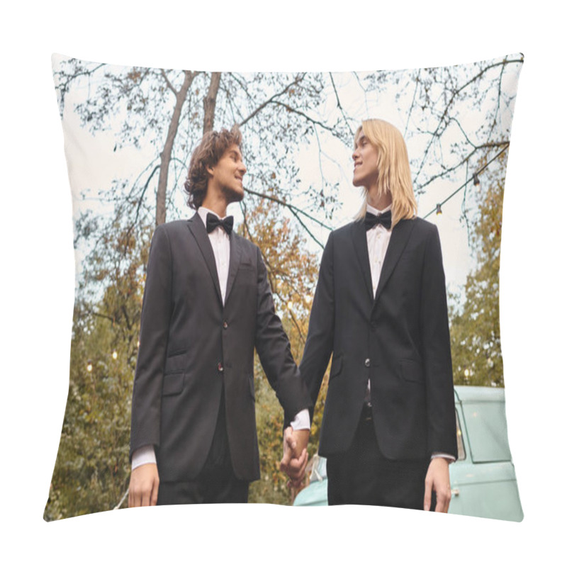 Personality  In A Serene Garden, Two Charming Young Men Dressed In Sleek Suits Hold Hands, Gazing Into Each Others Eyes. The Atmosphere Is Romantic, With Trees Framing The Enchanting Backdrop. Pillow Covers