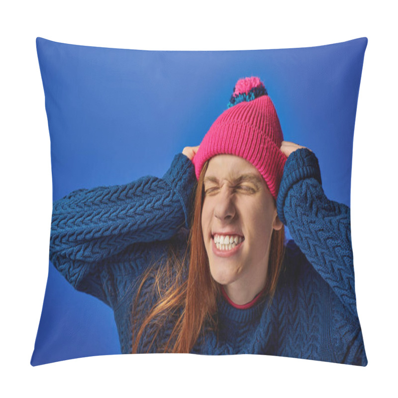 Personality  Young Man Expresses Intense Emotions While Holding His Head, Dressed In A Vibrant Sweater And Hat. Pillow Covers