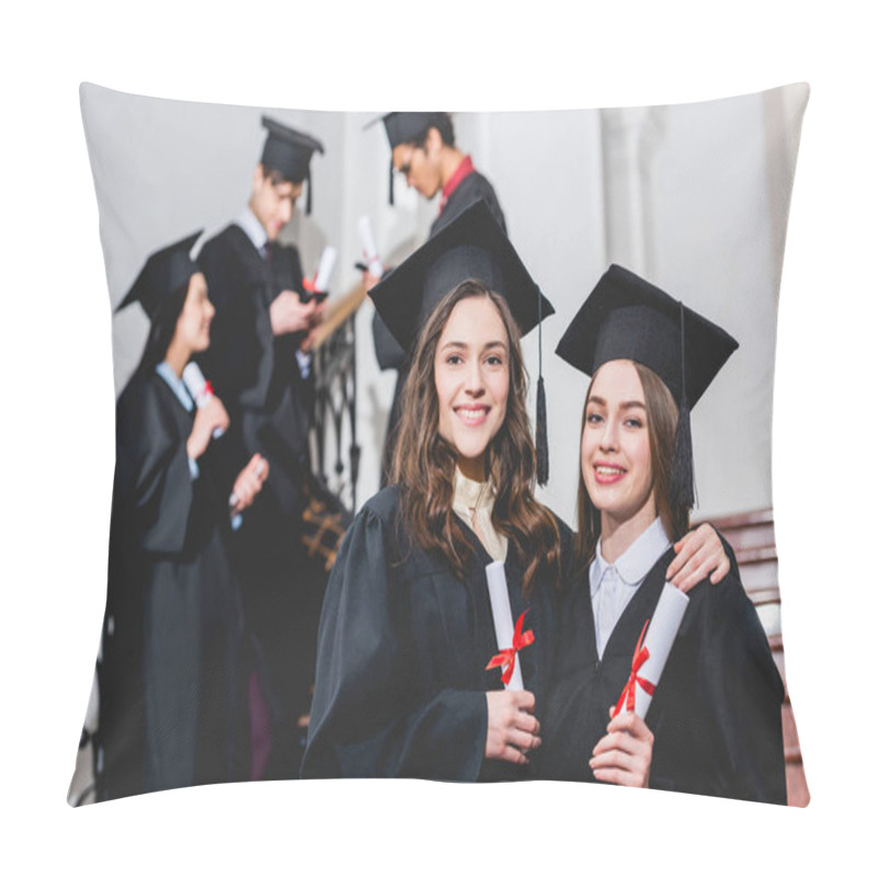 Personality  Selective Focus Of Beautiful Girls In Graduation Caps Smiling While Holding Diplomas Near Students Pillow Covers